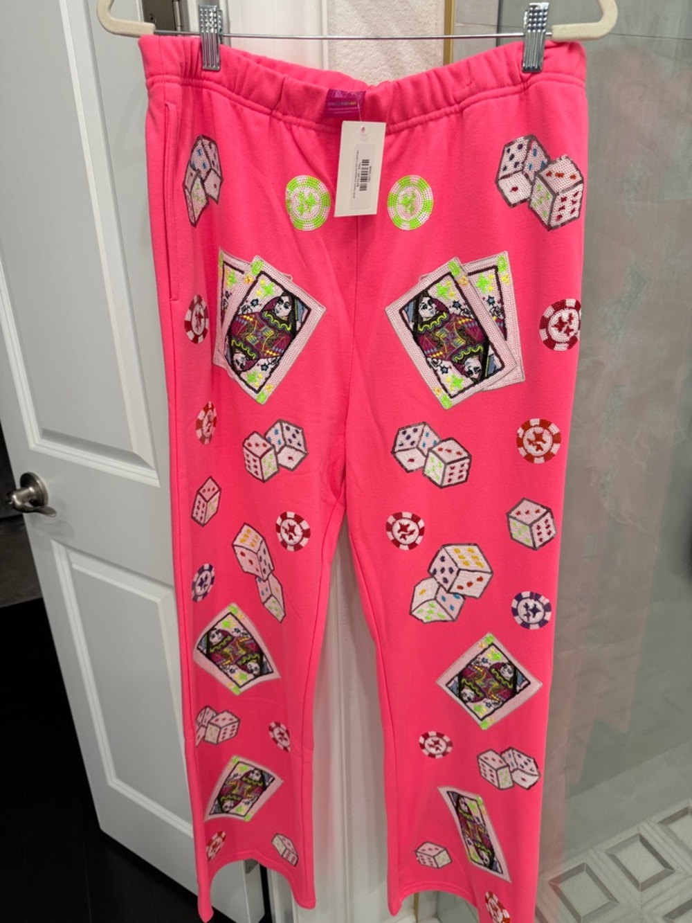 Queen of sparkles hot pink casino sweatpants.